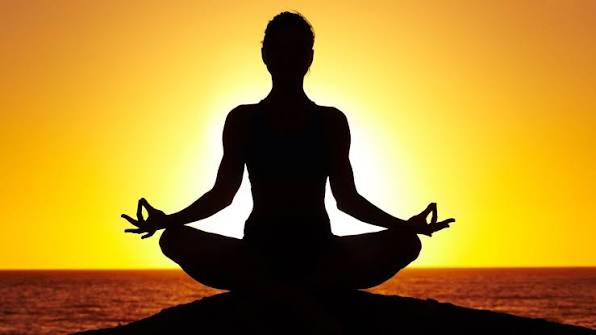 Person doing mindful stretching in a bright studio
